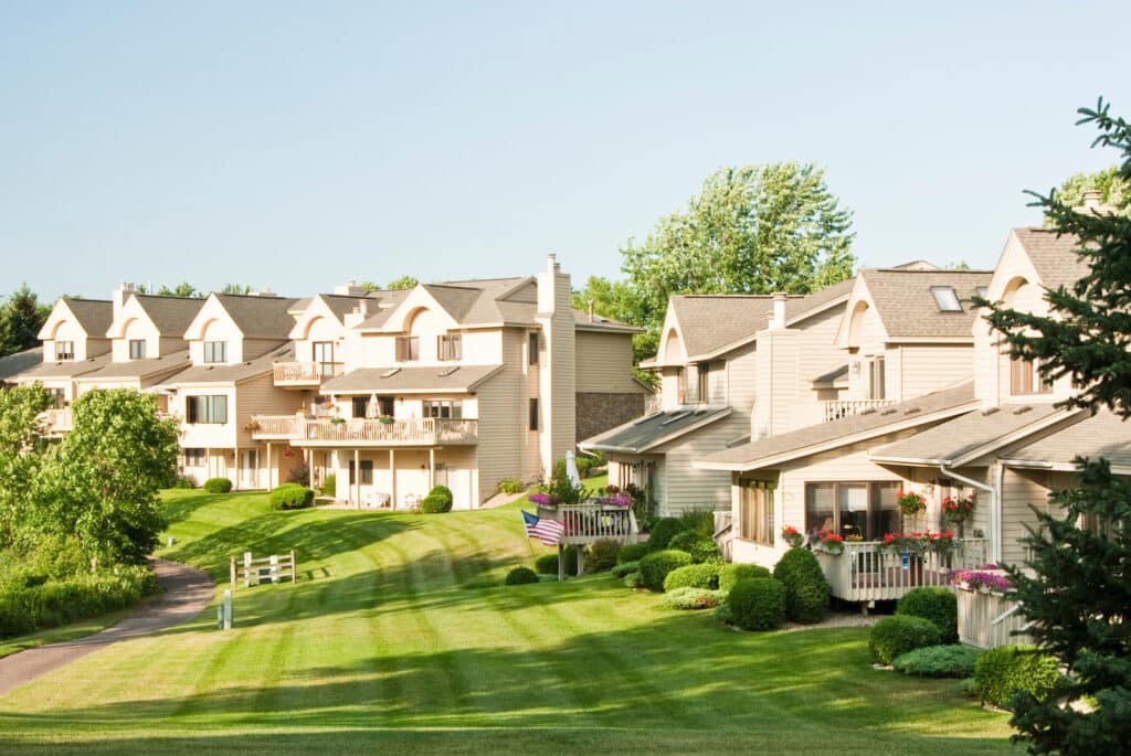 View of the back yards of multiple family residences in a suburban neighborhood.